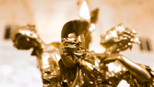 close-up of polished brass figurine with reflective surface for patina vs polish care guide on brass figurines