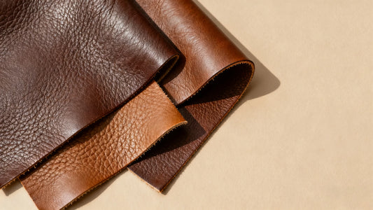 close-up comparison of natural full-grain leather textures on a neutral background