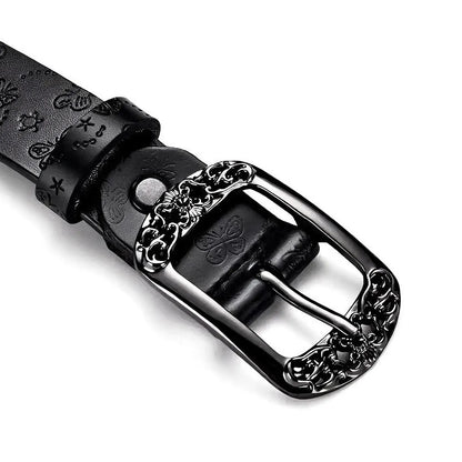 Close-up of black belt for women featuring embossed butterfly design and metal buckle