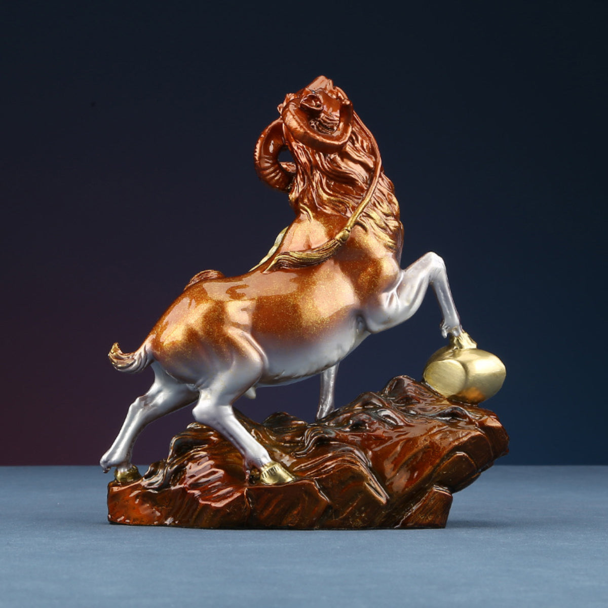 Angled view of goat brass figurine for harmony and balance