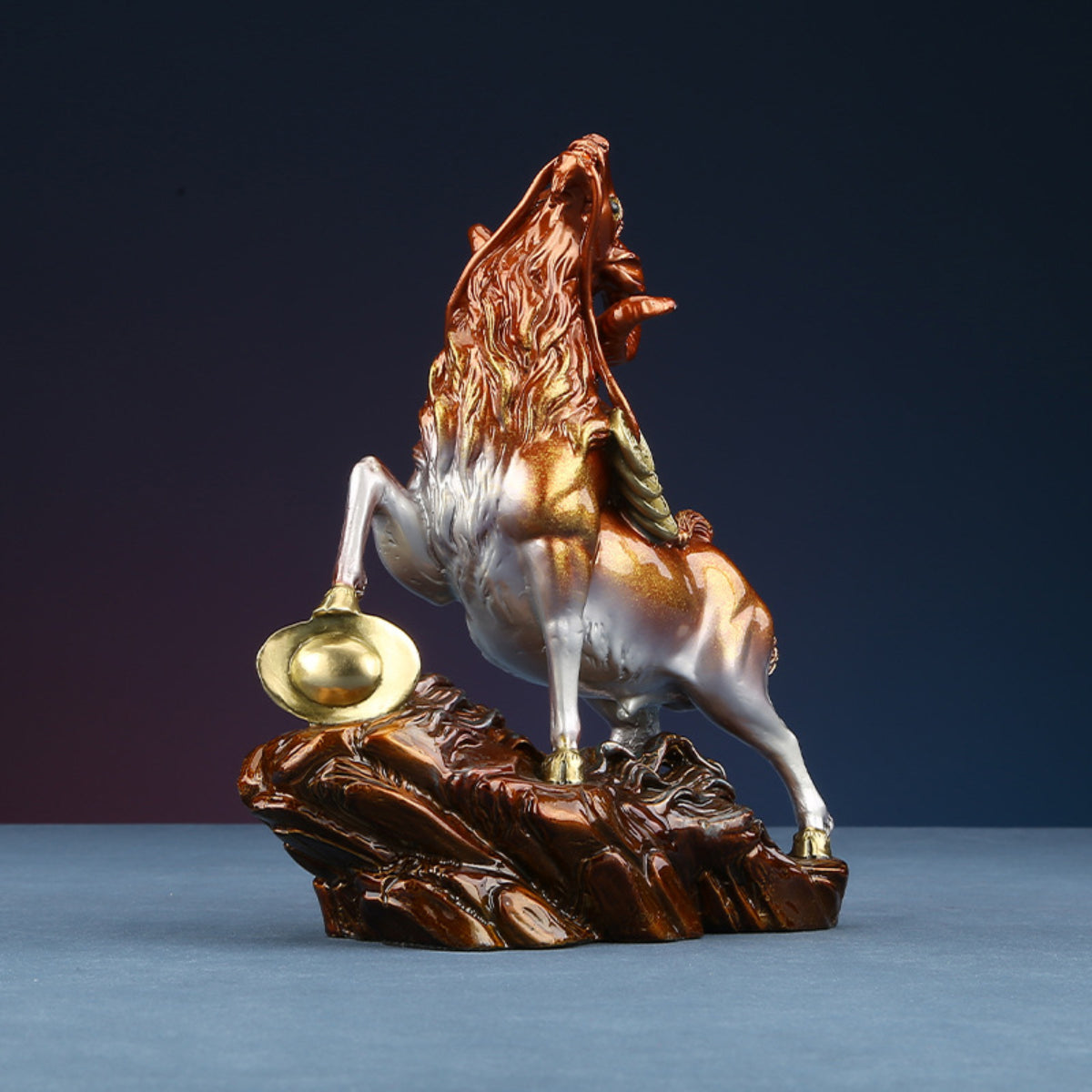 Side view of goat brass figurine for wealth and success