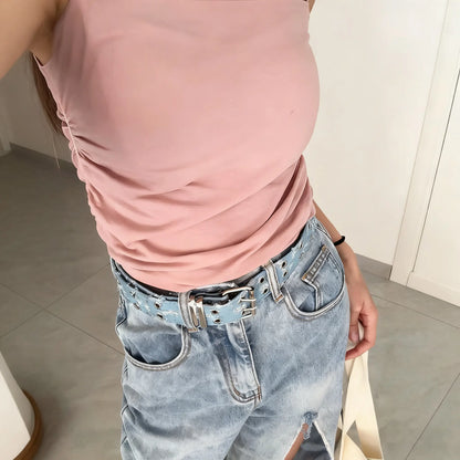 Women’s Y2K denim studded belt styled with jeans – trendy casual look