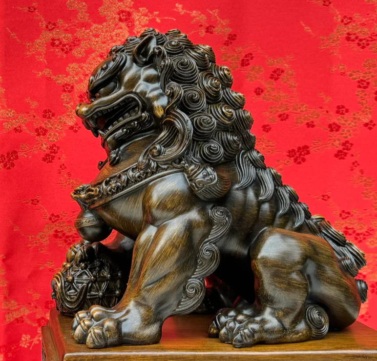 Bronze Chinese guardian lion statue symbolizing strength and protection in Feng Shui