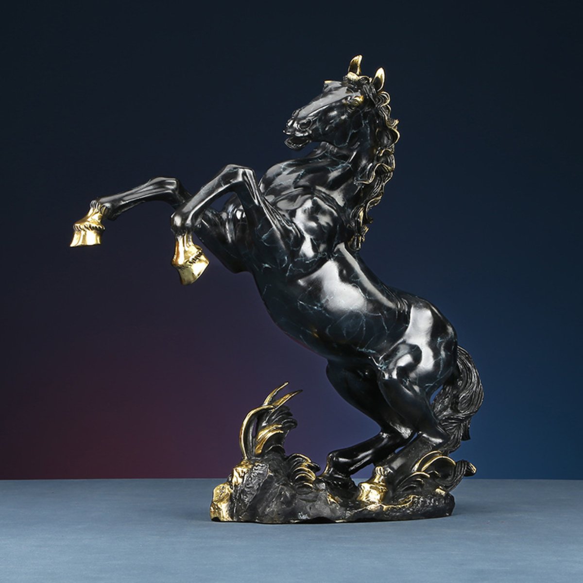 Majestic horse statue in black and gold, rearing pose for strength, success, and health blessing — front angle view