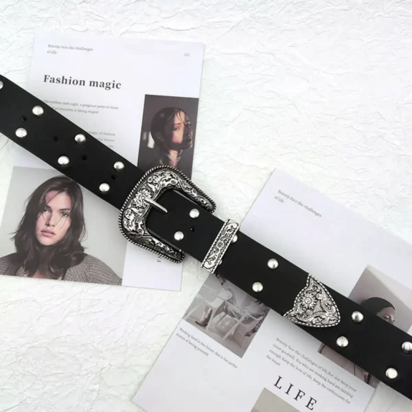 Flatlay of Nova women belt with studded details and engraved buckle, a statement accessory for y2k belt lovers.
